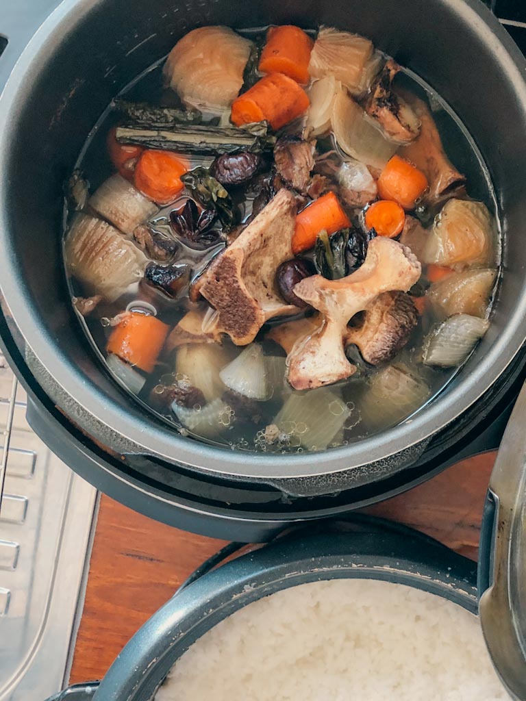 Beef bone broth ingredients in instant pot and fresh boiled rice