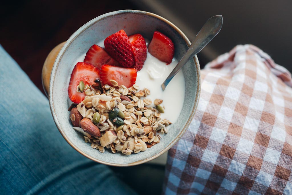 Natural yogurt, homemade granola and strawberries. 