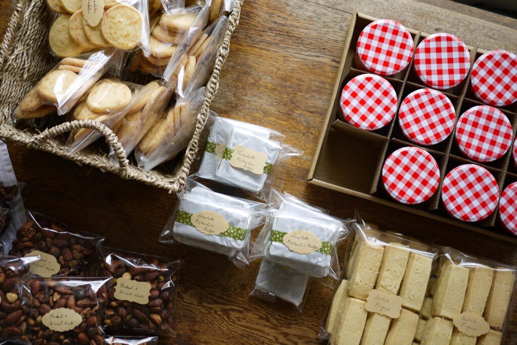 Christmas hamper Ideas: from top left to right, cheddar sables, pistachio fudge, apricot jam, shortbread Scotch fingers and herbed & spiced nuts. 